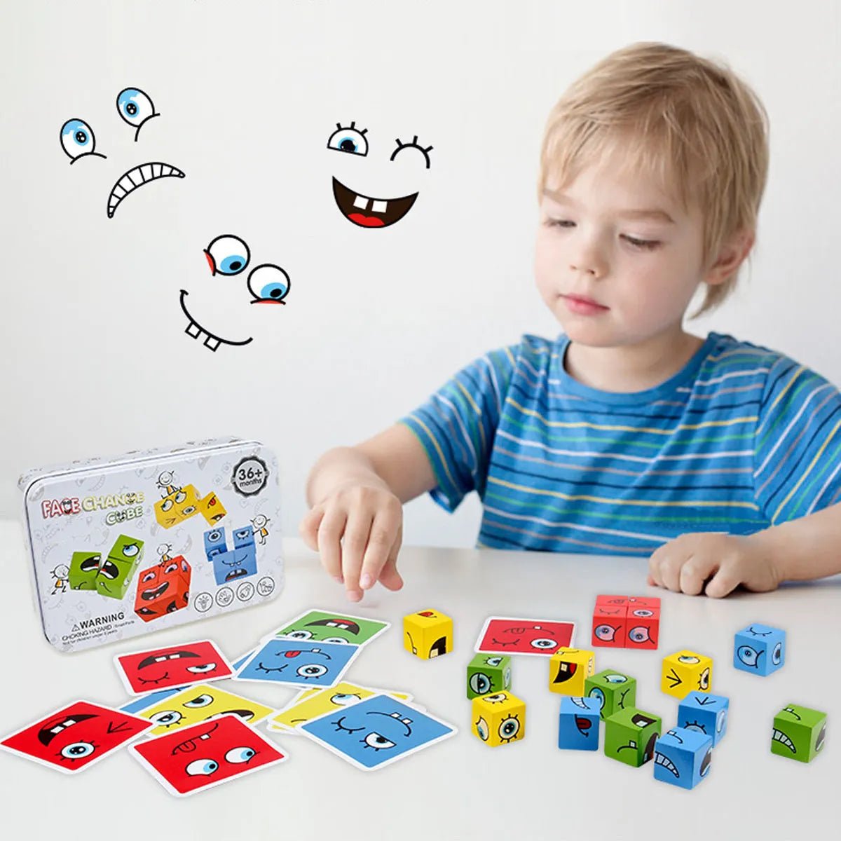 Petit garçon jouant avec un cube casse tete colorés et des cartes aux visages expressifs. Boîte de jeu à côté.